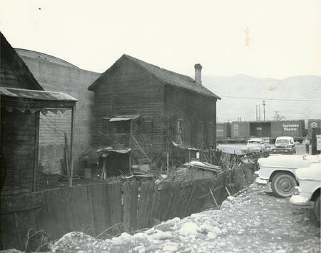 This photo is an external view of the hip sing tong, or old Chinese masonic lodge in Lewiston, Idaho, standing next to the Beuk Aie Temple, popularly known as the Beuk Aie Miu or Joss House. The Hip Sing Tong Was Located Just North Of The Beuk Aie Miu Temple At 513 C Street (not Capital Street), And Was A Two-story Structure On The South Side Of C Street, Between Third And 4th Streets, Relocating To This Location Around 1890.