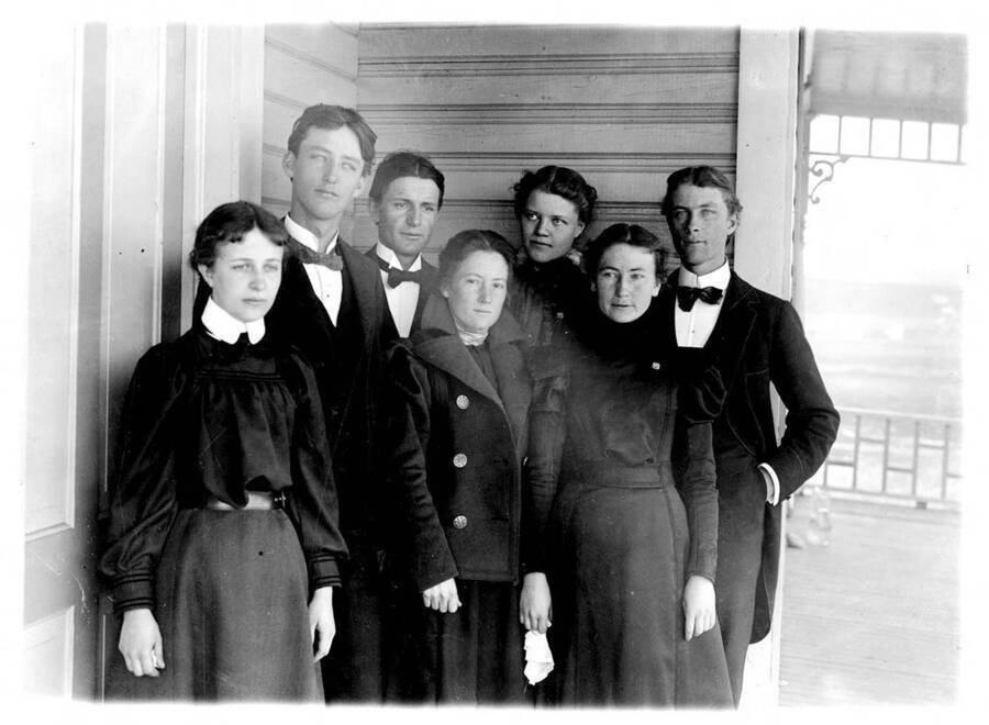 Students of the class of 1898 stand for a photograph on the front porch of one of the residence halls. 1898 was the year that the first graduate degree was awarded. Individuals identified from left to right: Ollie M. Mcconnell, Charles S. Simpson, Edward Smith, Margaret McCallie, Lola Margaret Lolo Knepper, Clara Ransom, Marcus Whitman Barnett.