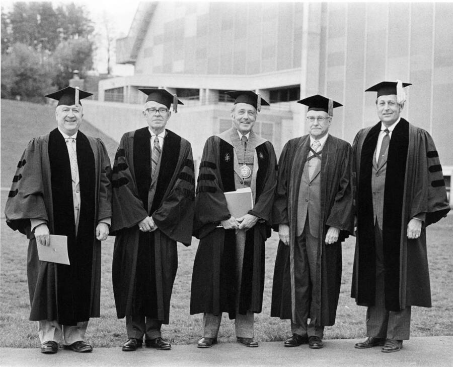 Honorary degree recipients shown with University of Idaho President Ernest W. Hartung at Commencement. From left: Leonard J. Arrington, Glen C. Holm, Ernest W. Hartung, J. Harold Wayland and Curtis J. Berklund