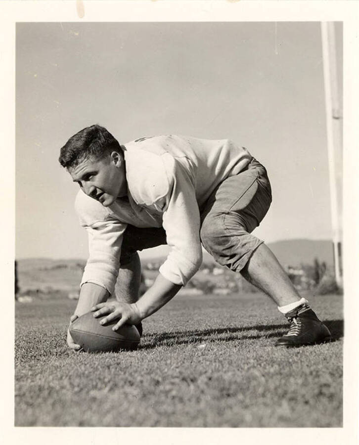 An action shot of Arthur Bland and a football on the field.
