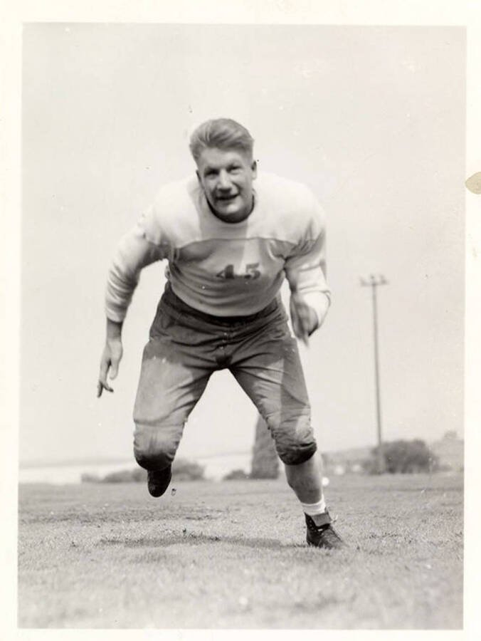 Action shot of Cleo Rowe, a guard for the University of Idaho football team.