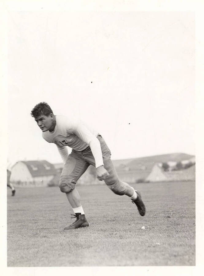 Action shot of John Tomich, a guard for the University of Idaho football team.