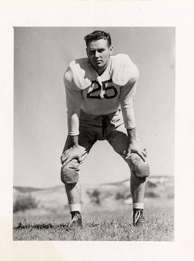 Center for the University of Idaho football team, #25 Ralph Paasch on the field.