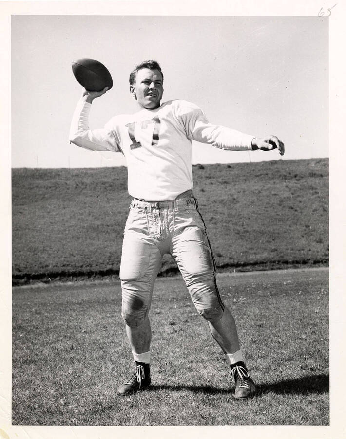 Wayne Anderson (#17), quarterback for the University of Idaho football team, throwing a football.
