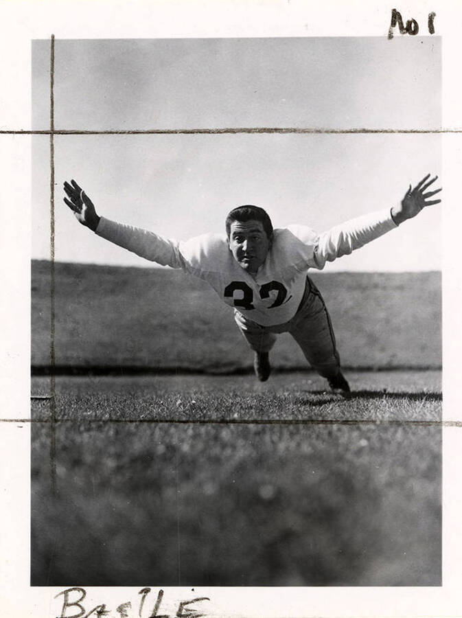 University of Idaho football player, Joe Basile (#32) displaying his tackle form.