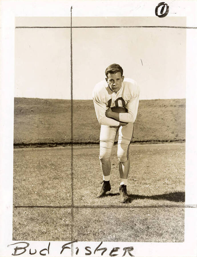 Fullback for the University of Idaho football team, Bud Fisher (#10), holding a football.