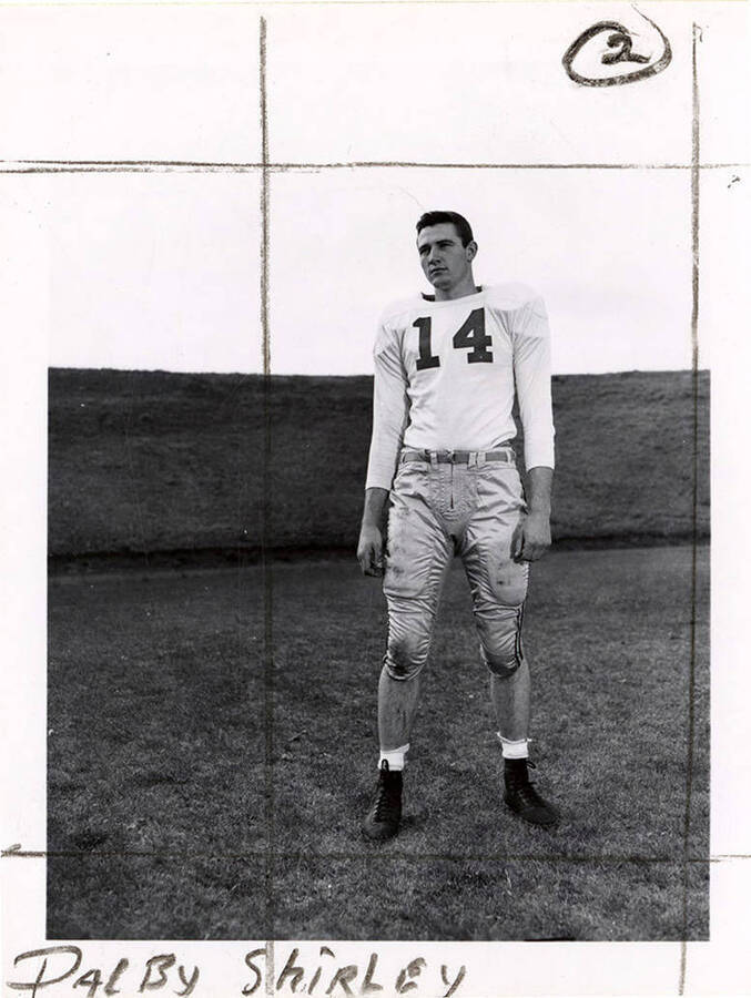 Fullback for the University of Idaho football team, Dalby Shirley (#14) standing on the football field.