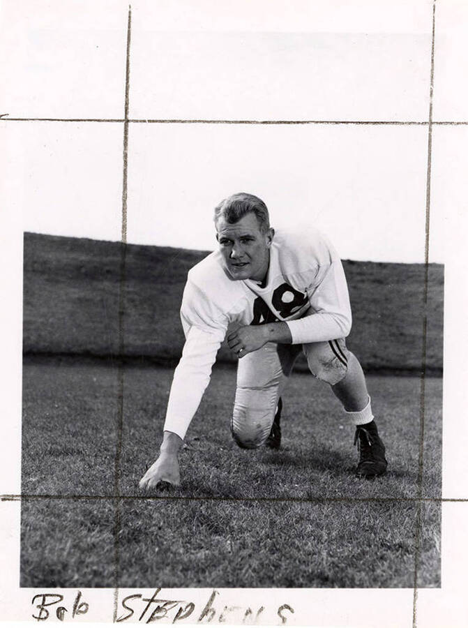 Bob Stephens (#48), a player for the University of Idaho football team, crouching on the football field.