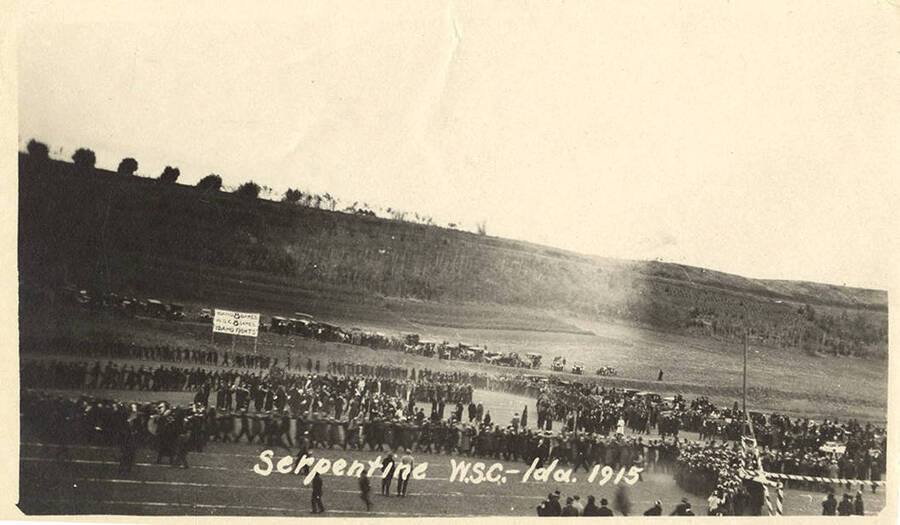 A photograph of a crowded field for University of Idaho's serpentine celebration before the Washington State College and U of I football game.