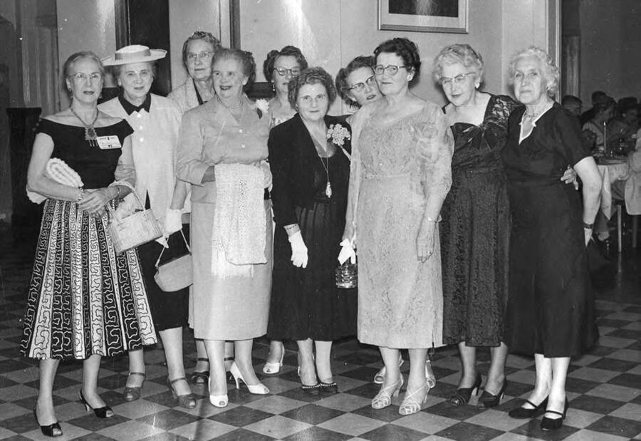 Former Chi Delta Phi members attend the  40th anniversary of the 1917 Graduation. Standing left to right: Flora Loomis Stillinger, Bertha Povey Davis, Beulah Carey Foster, Ada Povey Jordan, Alice Swanson Wood, Edna Herrington, Margaret Rawlings, Mary Nodle Crozier, Mayme Stapleton Carey, Gertrude Axtell.
