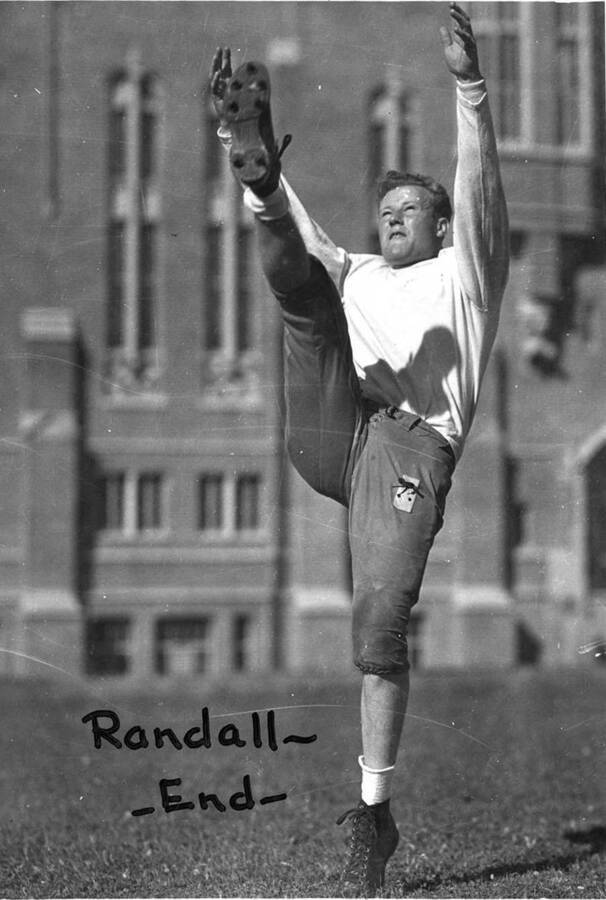 University of Idaho football team end, Randall, displaying his kicking form.