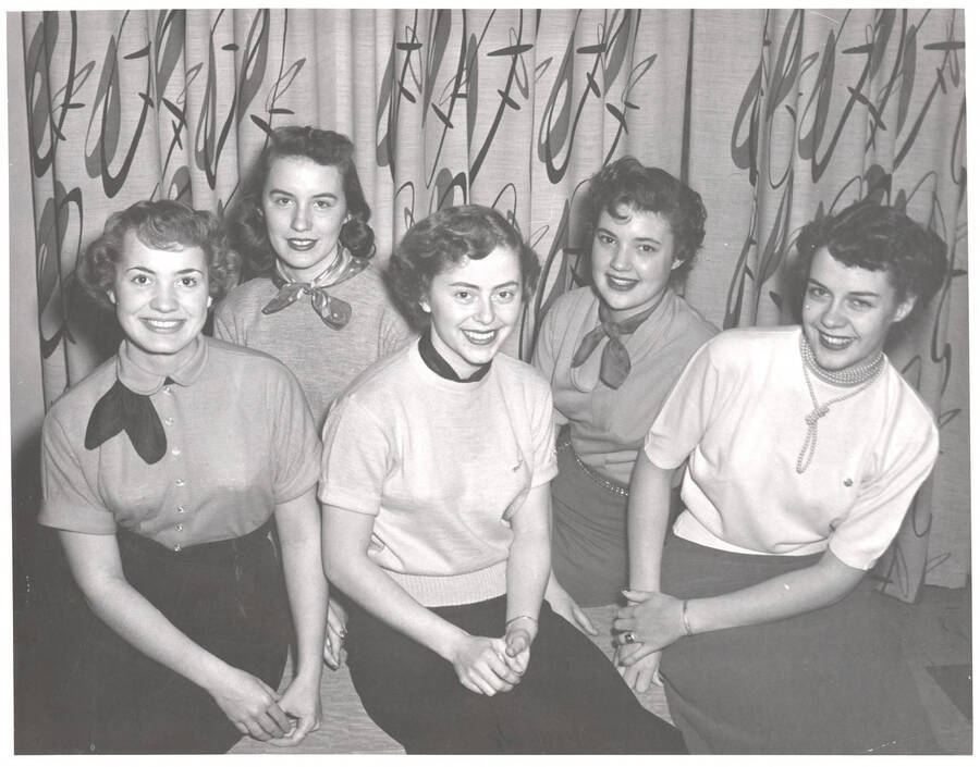 Muriel (Bobbie) Hargis, Betty Ruth Westerberg, Donna Bray, Margaret Alley (Queen), and Ann Louise Luedke, sitting together as a court.