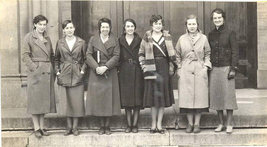 Theta Sigma members pose for a photograph outside of the Administration building. Theta Sigma is a local journalism honorary society for women.