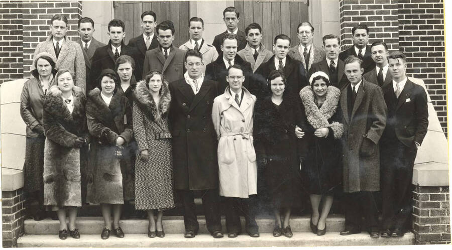 The DeSmet Club members stand in front of a building for a group photo. The DeSmet Club is a local organization for Catholic students.