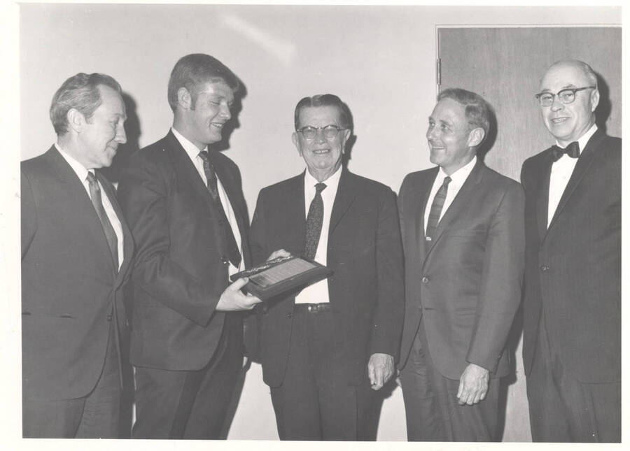 J.L. Driscoll, chairman of the Board of Directors of the First Security Bank of Idaho, accepts a plaque for '1969 Idaho Businessman of the Year'.