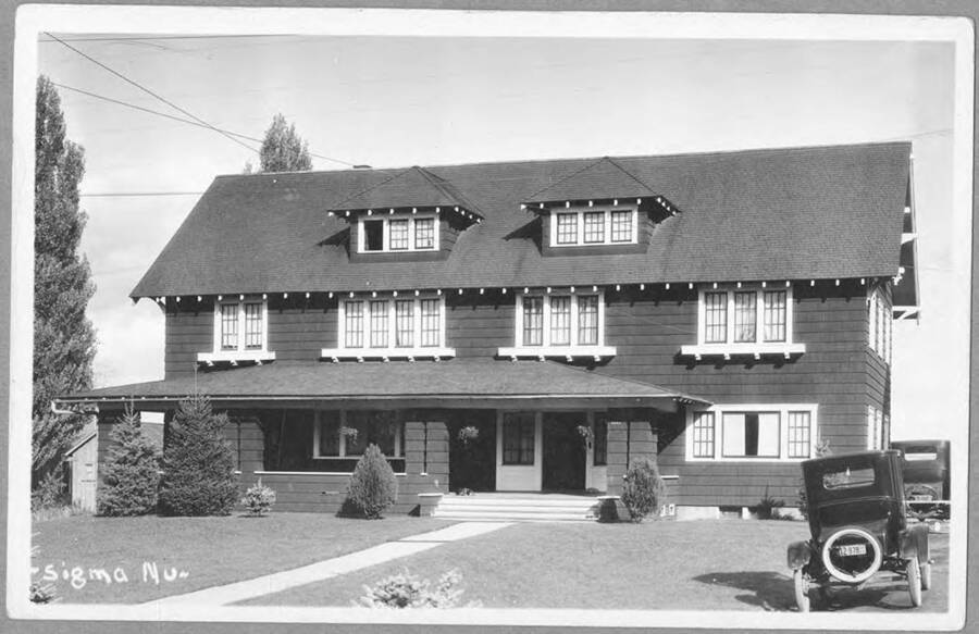 A front-facing photo of Sigma Nu house, located at 1030 Blake Avenue on the University of Idaho campus. Caption reads '~Sigma Nu~'