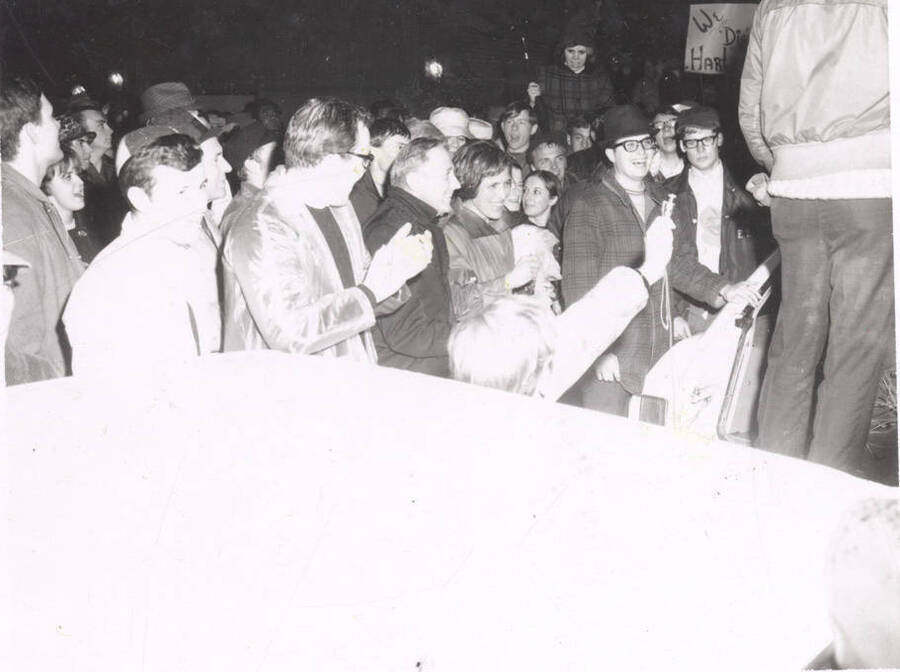 U of I President Ernest W. Hartung and Mrs. (Mary) Hartung standing with the crowd at the Hartung rally.