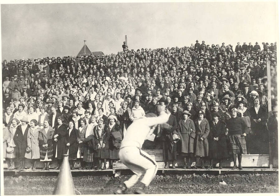 Students yell and cheer during a sporting event on MacLean Field.