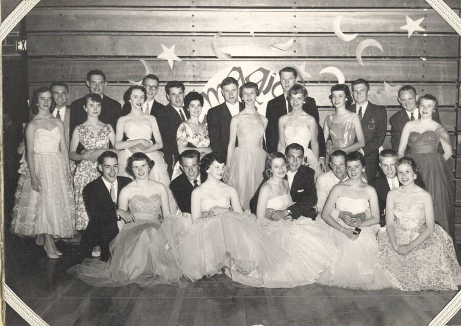 An unidentified fraternity group poses for a photo together at a dance.
