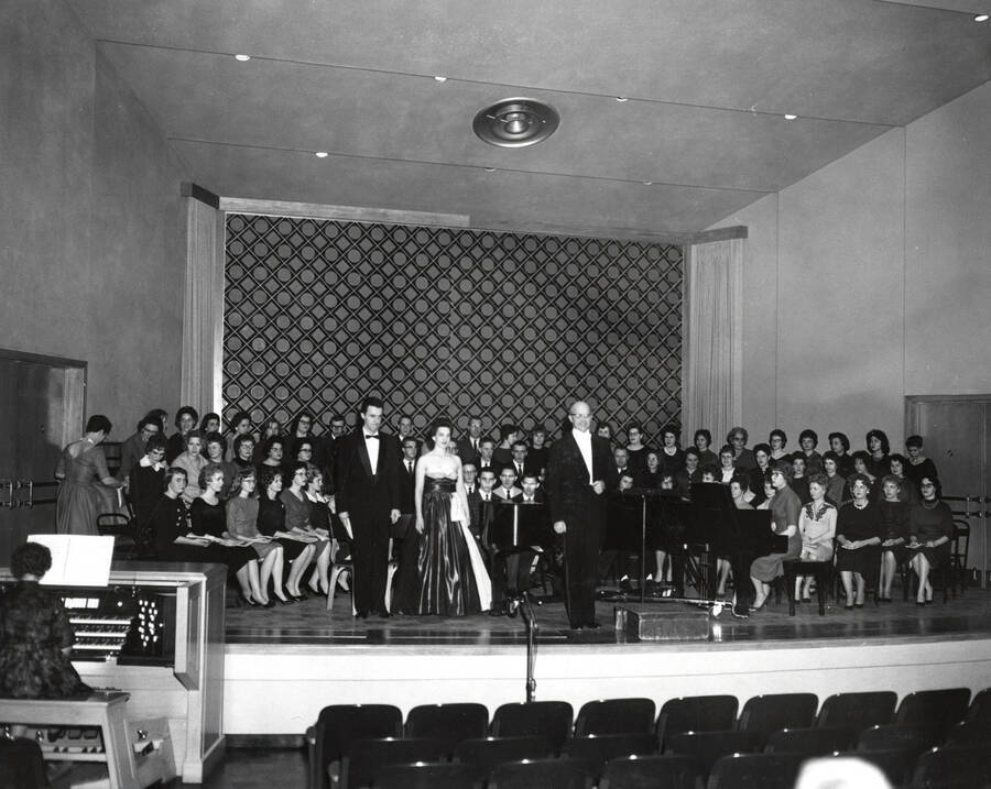 The University Singers perform selections from 'A German Requiem' on stage.