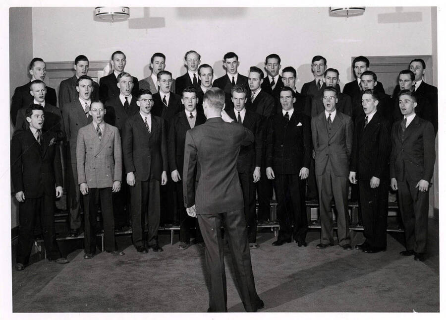 The University Singers men's chorus rehearse before a performance.