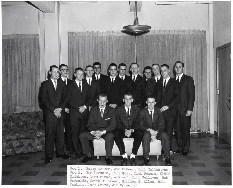Members of the Interfraternity Council pose for a photo together. Individuals identified as listed. Front: Barry Nelson, Jim Scheel, Bill Ballantyne; back: Tom Leaonard, Bill Goss, Dick Powers, Clair Erickson, Dick Minas (adv.), Bill Sullivan, Bob Reynolds, Keith Kilimann, William E. Allen, Bill Jenkins, Kurt Smith, Jim Spinello.