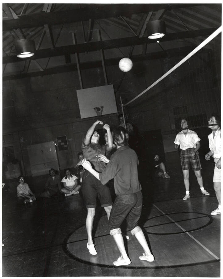 Women play volleyball in the Women's Gymnasium as part of the Women's Recreation Association.
