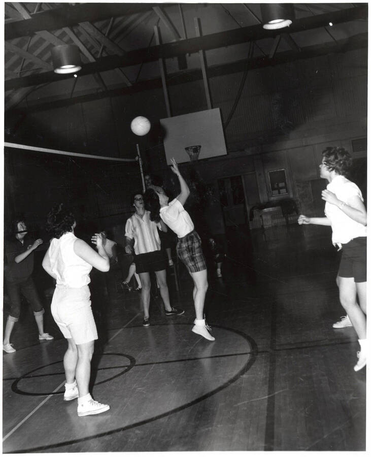 Women play volleyball in the Women's Gymnasium as part of the Women's Recreation Association.