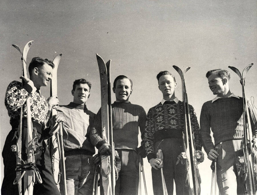 Members of the University of Idaho Ski team hold their skis while posing for a group photograph.