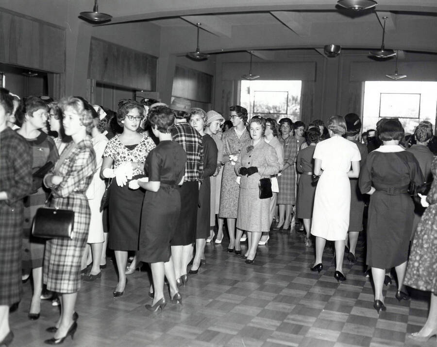 Women gather in the foyer of the Student Union Building before the Freshman women's tea.