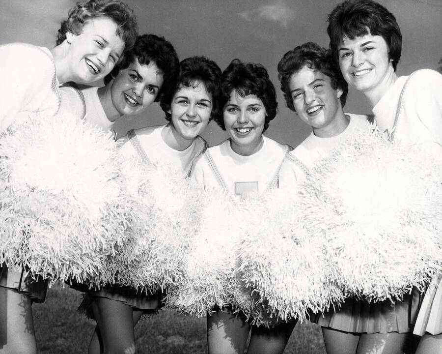 The Pom-Pom Girls huddle in for a group photograph.