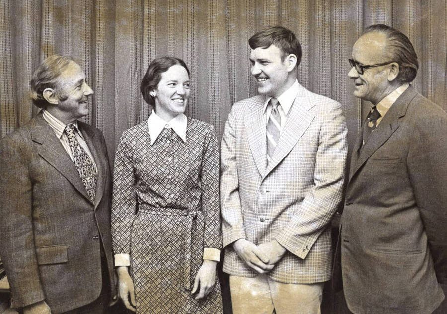Whittenberg Fellowship recipients Charlotte C. Iiams and Pat A. Pentland stand with President Ernest W. Hartung (left) and graduate school dean Ronald W. Stark.