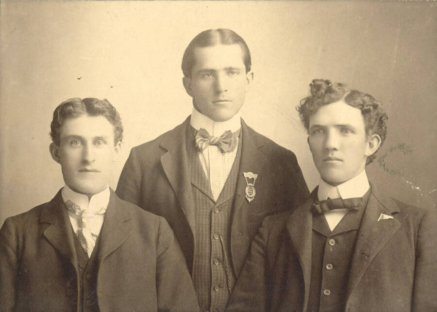 University of Idaho debate team members sit for a group picture. Individuals identified from left to right: Fred H. McConnel, Irl Eagle, Bill Lee.