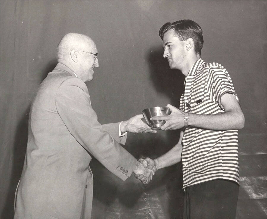 University of Idaho student William Bates receives the Arthur L. Swim Award from President Donald R. Theophilus.