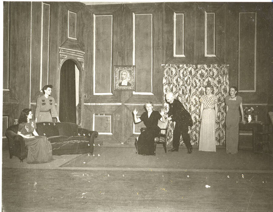 Students from l-r: Shirley Brandt as Joanna Trout, Patricia Barnes as Alice Dearth, Margaret Payne as Mrs. Coade, John Rowe as Lob, Dorothy Greaves as Lady Caroline, and Polly Harris as Mabel Purdie. The living-room scene of 'Dear Brutus' by Idaho drama students.