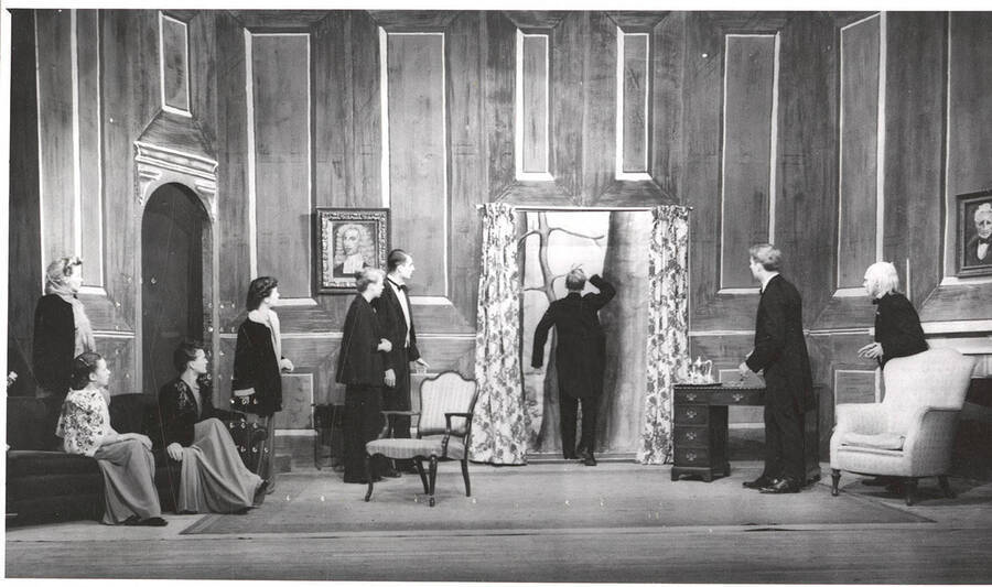 From l-r: Dorothy Greaves as Lady Caroline, Patricia Barnes as Alice Dearth, Margaret Payne as Mrs. Coade, Guy Terwilleger as Mr. Coade, William Davidson as Mr. Dearth, Richard Paterson as Mr. Purdie and John Rowe as Lob. Idaho students act out the living-room scene of 'Dear Brutus.'