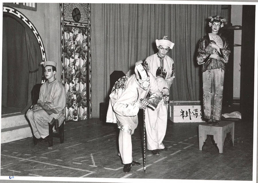 From l-r: Marvin Alexander as Chorus, Rod Greening as Yin Suey Gong, Jerry Sperrazzo as Wu Hoo Git and Margaret Magee as Chow Wan. Idaho drama students act out a scene in which Yin Suey Gong speaks in the Chinese play, 'The Yellow Jacket.'