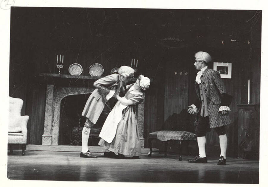 Performers from l-r: Gene Roth as Marlowe, Helen Gale as Miss Hardcastle and Cope Gale as Hardcastle. Miss Hardcastle refuses Marlowe's advances in Idaho drama's production of 'She Stoops to Conquer.'