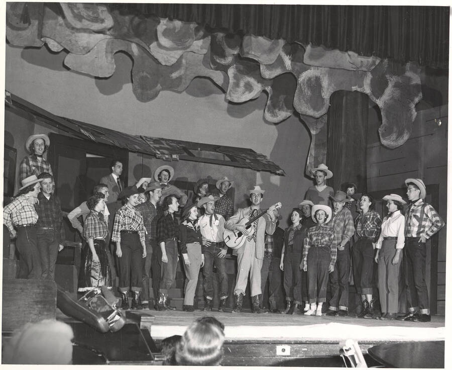 Individuals identified on mount; Idaho drama students perform a group singing scene during production of the play, 'Sing, Senator, Sing.'