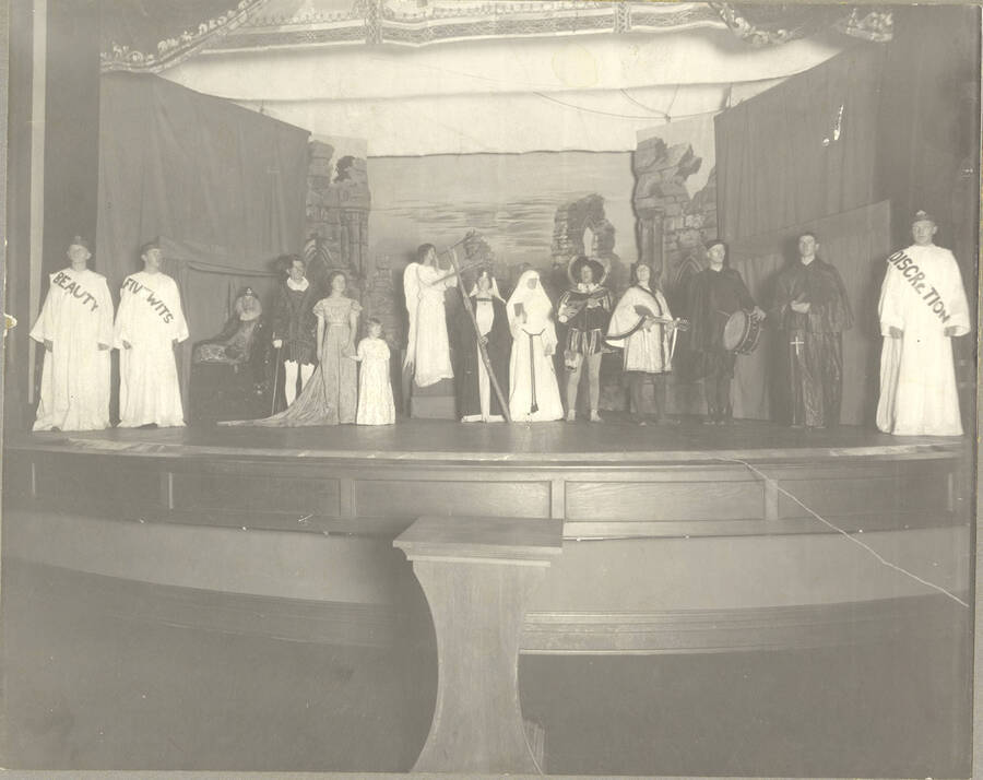 A group scene of Idaho drama's production presented by the English Club of the play, 'Everyman.' Every character is pictured on stage.