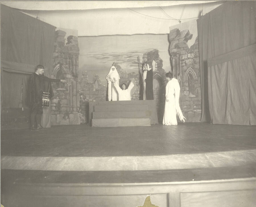 Lead actress Elizabeth Soulen prays in Idaho drama's production of 'Everyman,' directed by Henrietta E. Moore.
