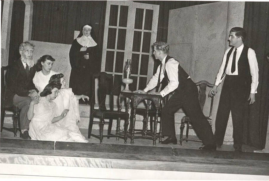 Students from l-r: Mary Alexander, Mary Thompson, Joan Coble, Bonese Collins, Joan Henry, David Burgess, Charles LaFollette. Idaho drama students act out a group scene in the production of the play, 'The Intruder.'