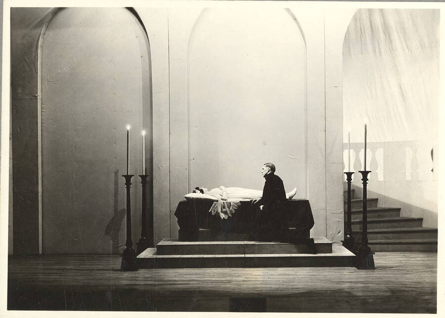Kneeland Parker, as Romeo, kneels before a sleeping Marie Gauer, as Juliet, in Idaho drama's production of "Romeo and Juliet."