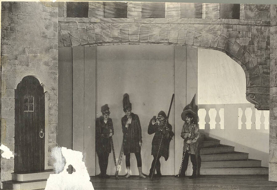 Background actors can be seen smiling in Idaho drama's production of "Romeo and Juliet."