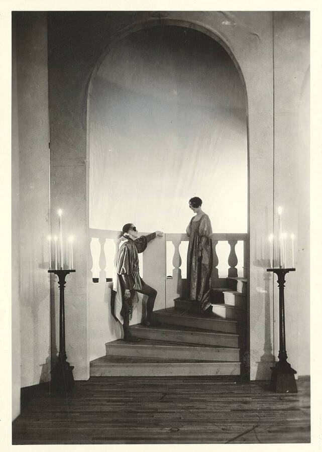Kneeland Parker, as Romeo, talks to Marie Gauer, as Juliet, on the stairwell during the ball scene of Idaho drama's production of "Romeo and Juliet."