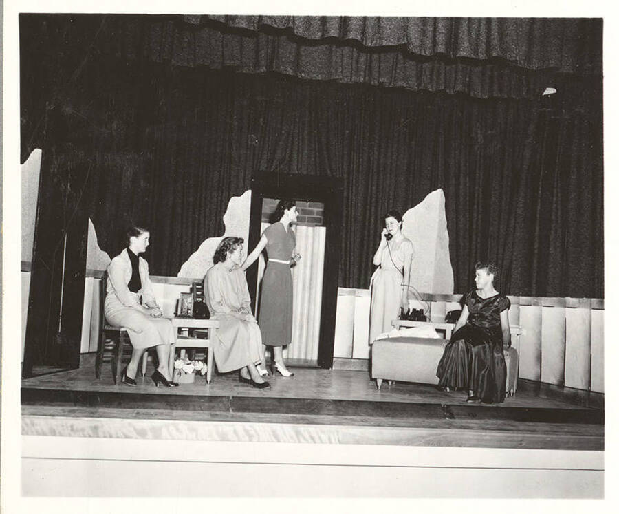 Students from left to right: Billie Payton, Joy Knudson, Carol Stanton, Myra Bergman, Gerri Williams. Idaho drama students act out a scene of "The Lady Who Came to Lunch" during a summer workshop.