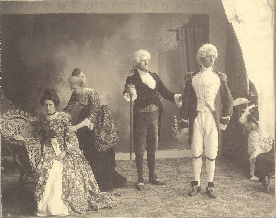 Students from left to right: Edna Moore as Lydia Languish, Anna Edna Clayton as Mrs. Malaprop, Fred McConnell as Sir Anthony Absolute and Homer David as Captain Absolute. Idaho drama students perform a group scene in the school production of "The Rivals."