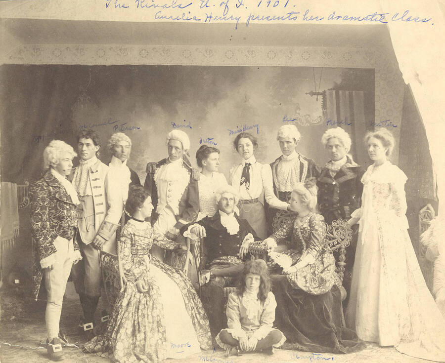 Students from left to right, standing: Ben Oppenheim, John McConnell, Andrew Peterson, Homer David, Nellie Ireton, A. Henry, William Lee, B. French, Mabel Martyn; seated: Edna Moore, Fred McConnell, A. Foster, Anna Edna Clayton. Idaho drama performers pose for a full cast photograph for the school's production of "The Rivals."