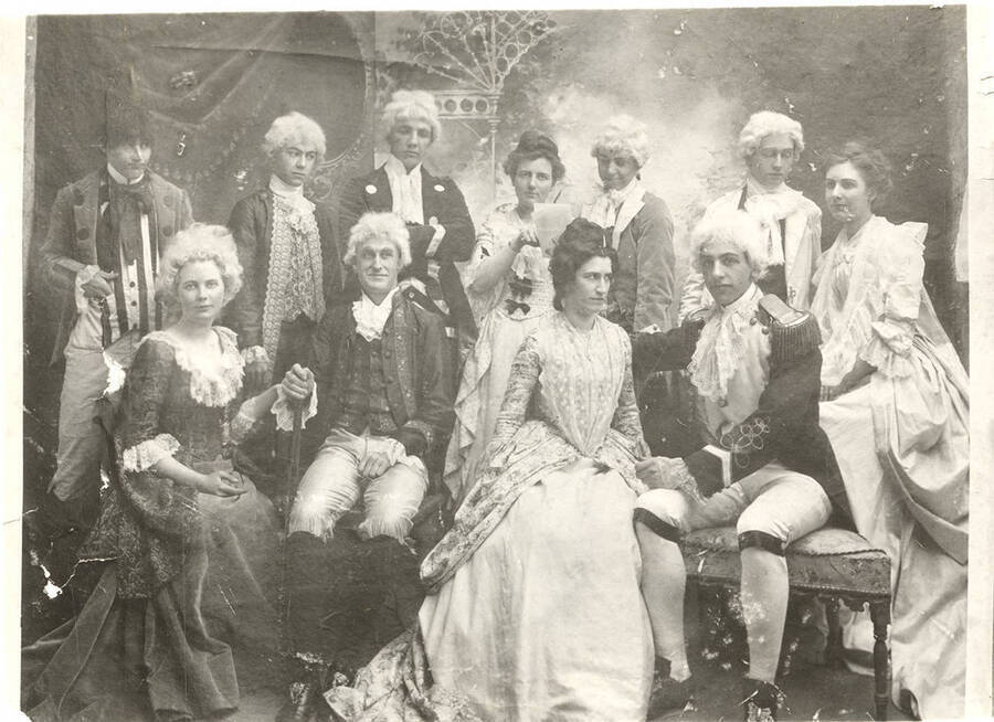 Students from left to right, standing: John McConnell, Ben Oppenheim, William Lee, Nellie Ireton, W. Griffin, Henry Sweet, Mable Martyn; seated: Anna Edna Clayton, Fred McConnell, Edna Moore, Homer David. Idaho drama students pose in costume for the production of "The Rivals."