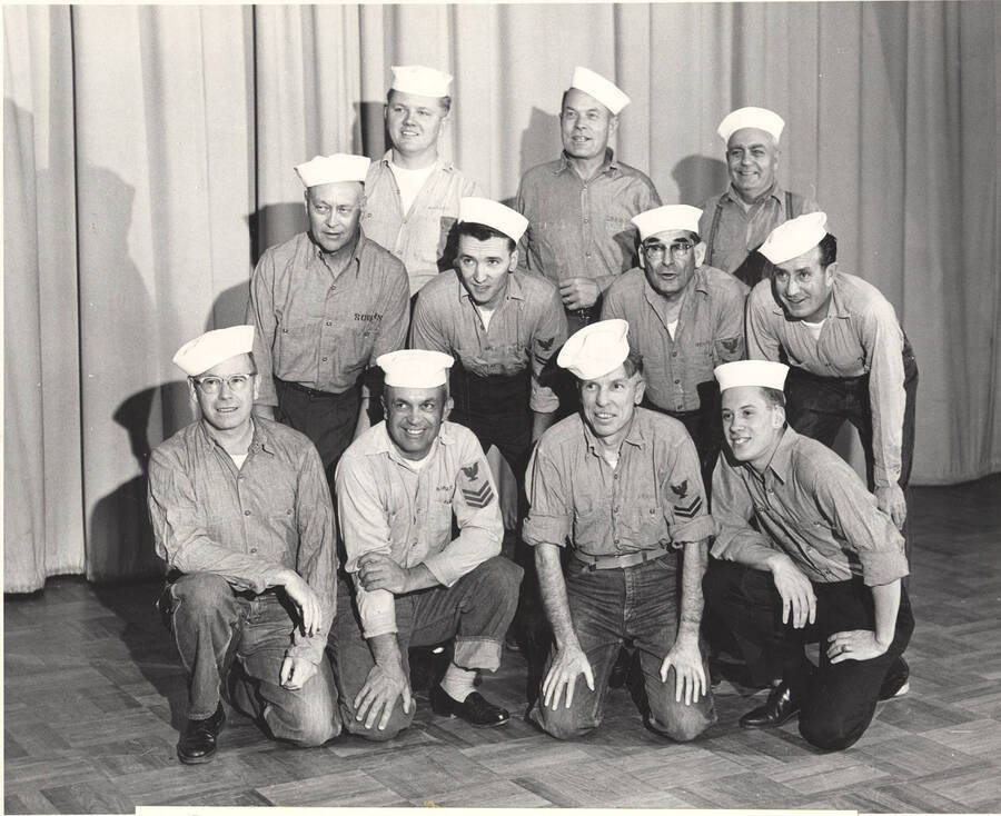 Students pictured: Top: Dave Lange, Eldred Thomas, Curt Talbott; middle: Don Corless, Gary Whitmore, William Marineau, Martin Huff; bottom: John McMullen, John Brown, Robert Hosack, Win Cook. The sailor chorus poses for a photograph prior to Idaho drama's production of "South Pacific."